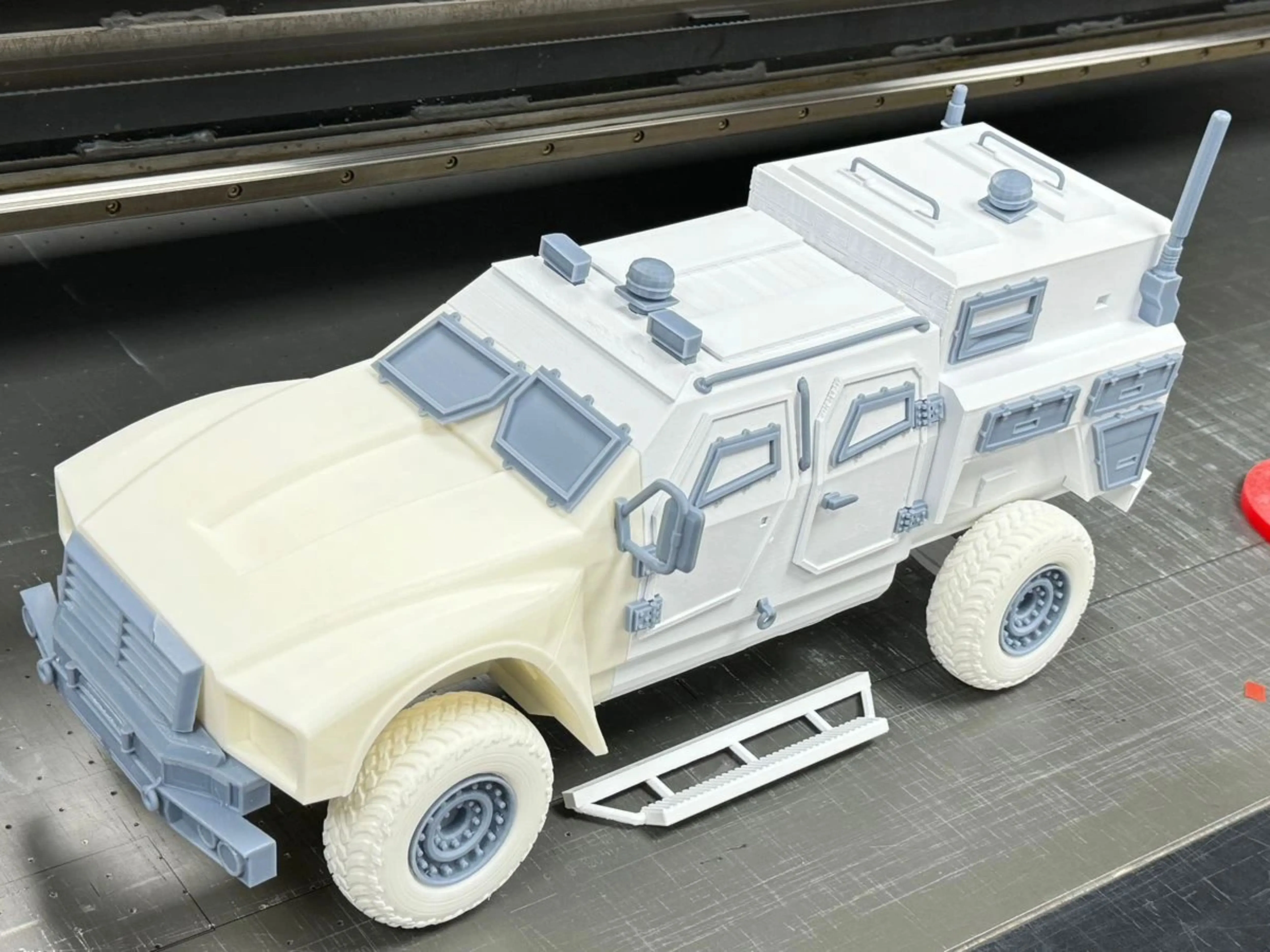 Bare 3D-printed APC scale model on the printer bed, three-quarter front view