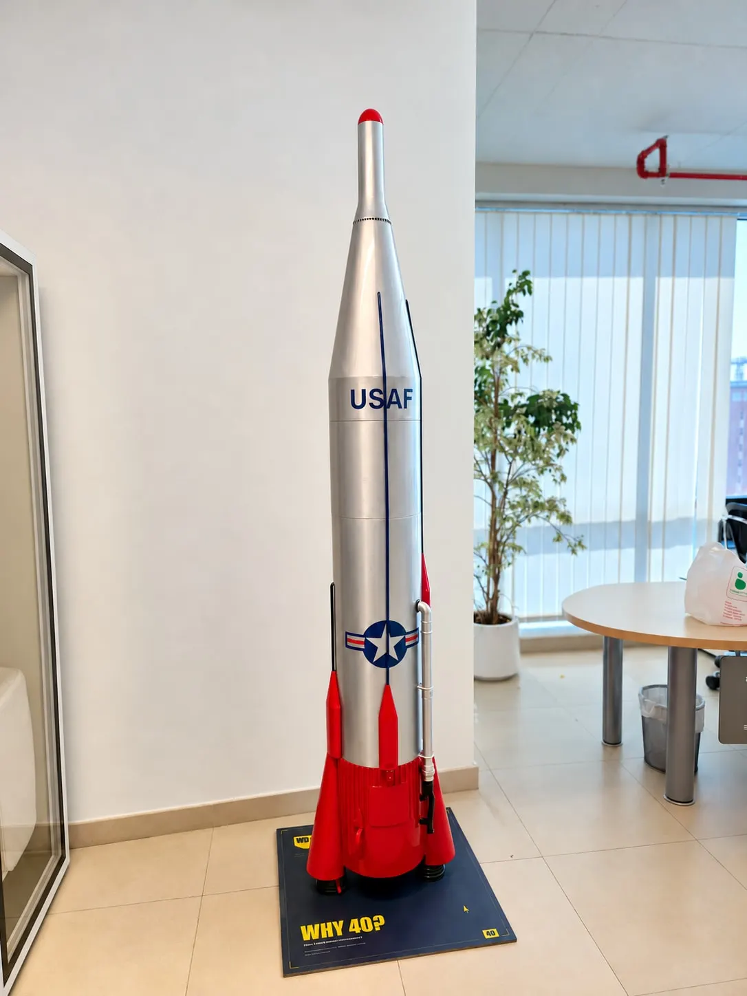 Finished WD-40 Atlas rocket replica standing on its navy WHY 40? plinth in the GDT Group office, Dubai